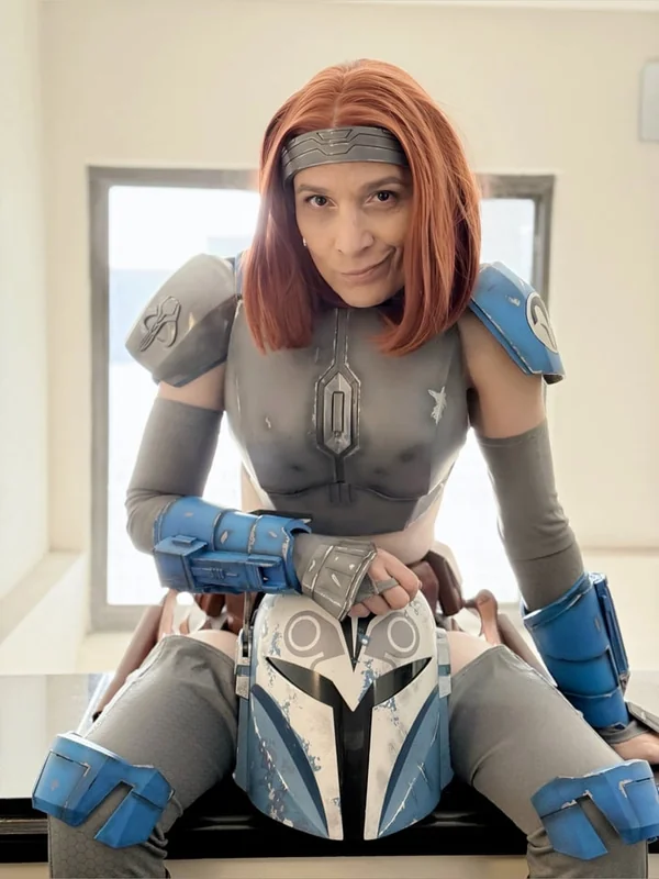 Cami OnlyFans profile with red hair and cosplay