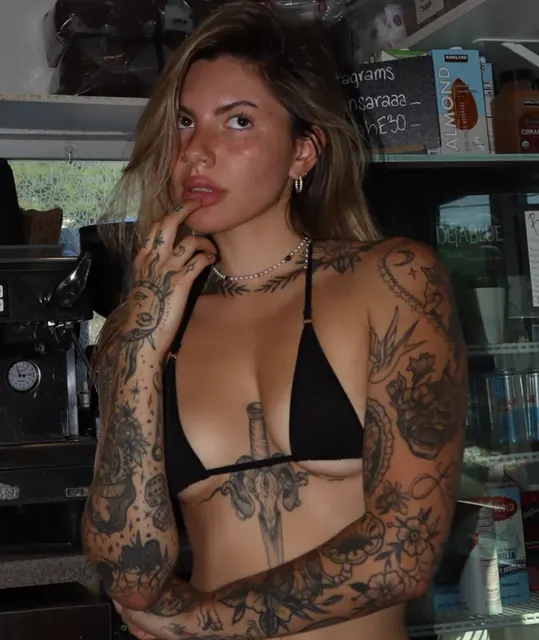 Sarah on OnlyFans with tattoos and a passion for cars