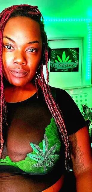 Smokestress OnlyFans creator with curly hair