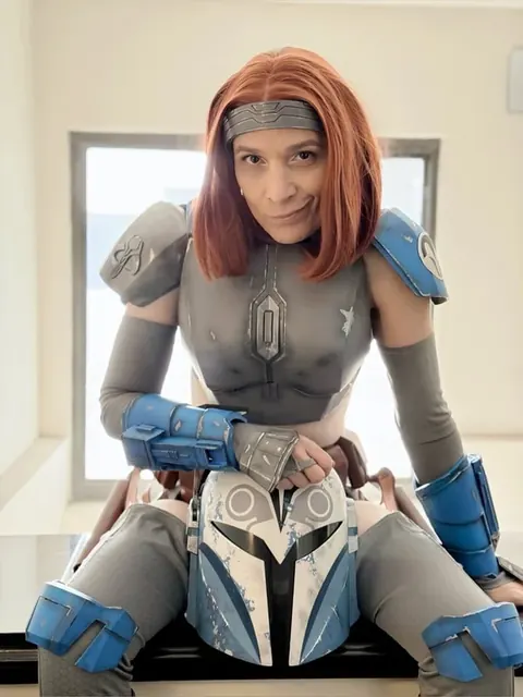 Cami OnlyFans profile with red hair and cosplay