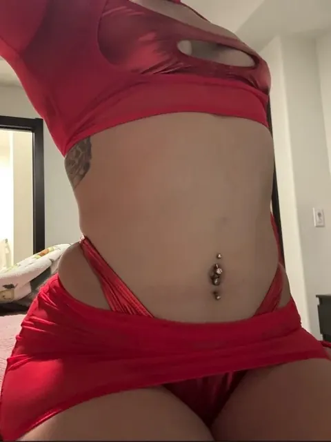 Tesla OnlyFans creator with tattoos and piercings