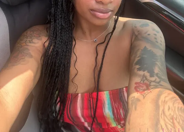 Carmela OnlyFans profile with tattooed beauty